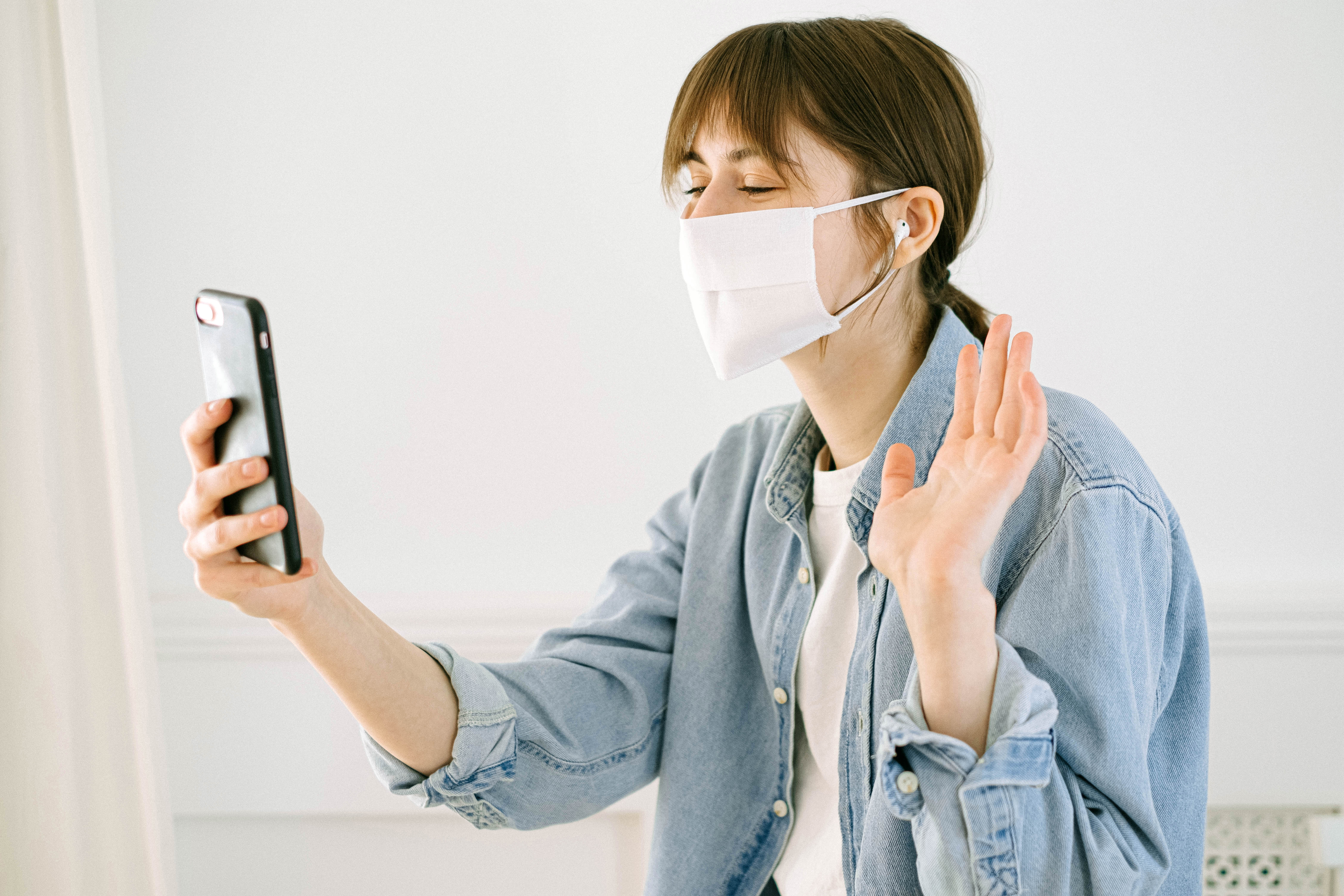 woman in face mask on a video call